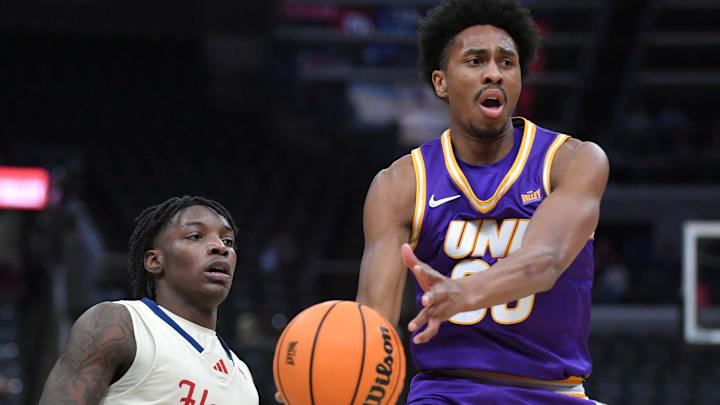 Mar 8, 2026; St. Louis, MO, USA;  Northern Iowa Panthers guard Leon Bond III (35) drives past UIC Flames guard Rashund Washington Jr. (5) during the second half at Enterprise Center.