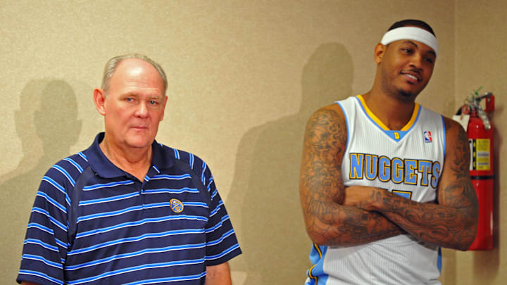 Sept 27, 2010; Denver, CO, USA; Denver Nuggets forward Carmelo Anthony (15) and head coach George Karl wait to speak at a press conference during media day at the Pepsi Center. Mandatory Credit: Ron Chenoy-Imagn Images