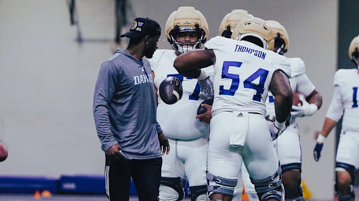 Simote Pepa (77) waits his turn in this defensive-line drill. 