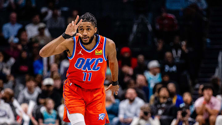 Apr 7, 2024; Charlotte, North Carolina, USA; Oklahoma City Thunder guard Isaiah Joe (11) celebrates a three point basket against the Charlotte Hornets during the fourth quarter at Spectrum Center. Mandatory Credit: Scott Kinser-USA TODAY Sports