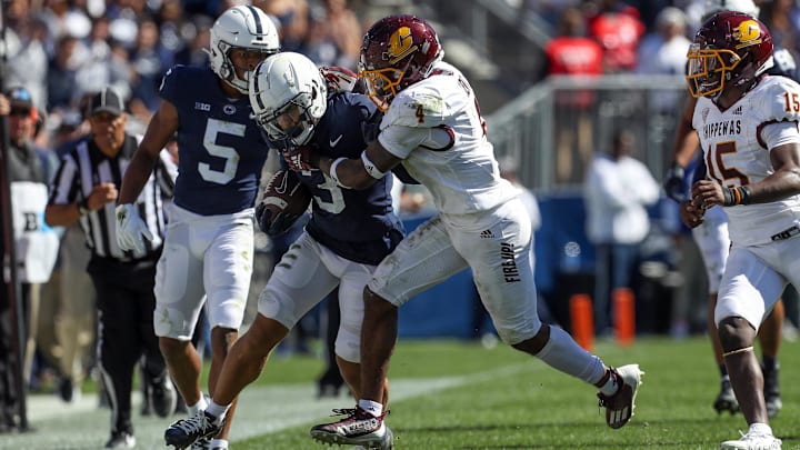 Sep 24, 2022; University Park, Pennsylvania, USA; Penn State Nittany Lions wide receiver Parker Washington (3) runs with the ball before being pushed out of bounds by Central Michigan Chippewas defensive back Donte Kent (4) during the third quarter at Beaver Stadium. Penn State defeated Central Michigan 33-14. Mandatory Credit: Matthew OHaren-Imagn Images