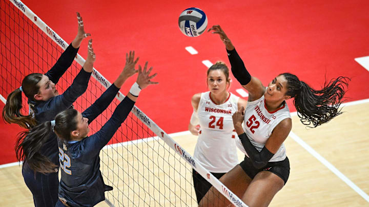 Wisconsin middle blocker Carter Booth (52) hits against Marquette in a spring match Wednesday, April 16, 2025, at the UW Field House in Madison, Wisconsin.