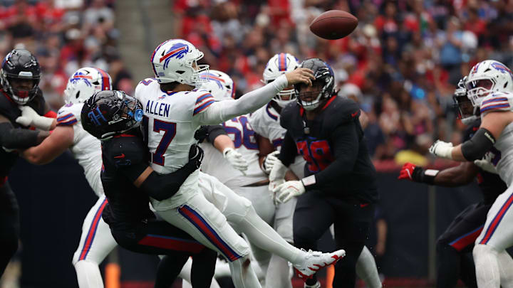 Buffalo Bills quarterback Josh Allen (17) gets hit by Houston Texans safety Jalen Pitre (5) in the second half at NRG Stadium. Buffalo Bills quarterback Josh Allen (17) gets hit by Houston Texans safety Jalen Pitre (5) in the second half at NRG Stadium.
