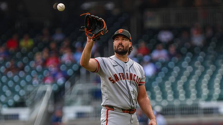 San Francisco Giants pitcher Robbie Ray (38) catches the ball after pitching. 