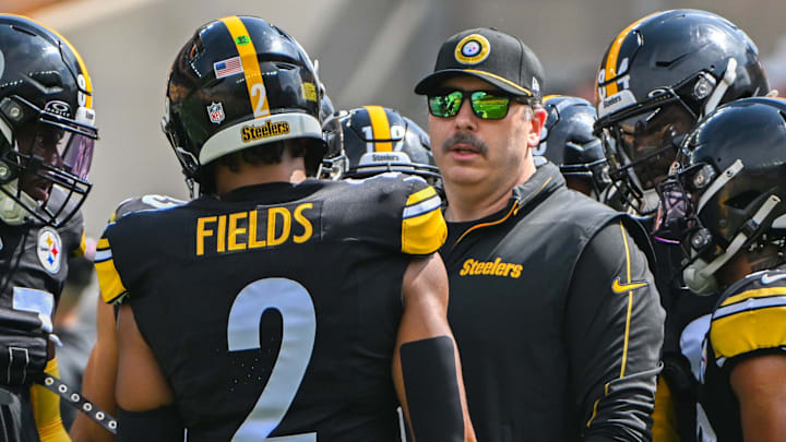 Sep 22, 2024; Pittsburgh, Pennsylvania, USA; Pittsburgh Steelers offensive coordinator Arthur Smith talks with quarterback Russell Wilson (3) during warmups for a game against the Los Angeles Chargers at Acrisure Stadium. Mandatory Credit: Barry Reeger-Imagn Images
