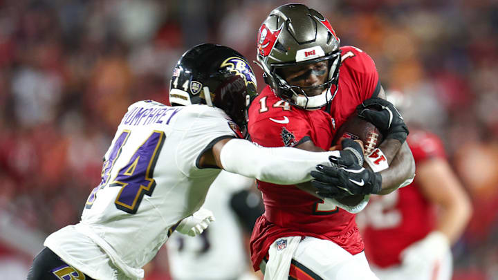 Oct 21, 2024; Tampa, Florida, USA; Tampa Bay Buccaneers wide receiver Chris Godwin (14) is pressured by Baltimore Ravens cornerback Marlon Humphrey (44) in the second quarter at Raymond James Stadium. Mandatory Credit: Nathan Ray Seebeck-Imagn Images