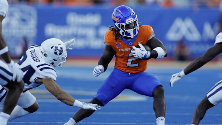 Oct 5, 2024; Boise, Idaho, USA; Boise State Broncos running back Ashton Jeanty (2) runs for gain during the first half against the Utah State Aggies at Albertsons Stadium. Mandatory Credit: Brian Losness-Imagn Images
