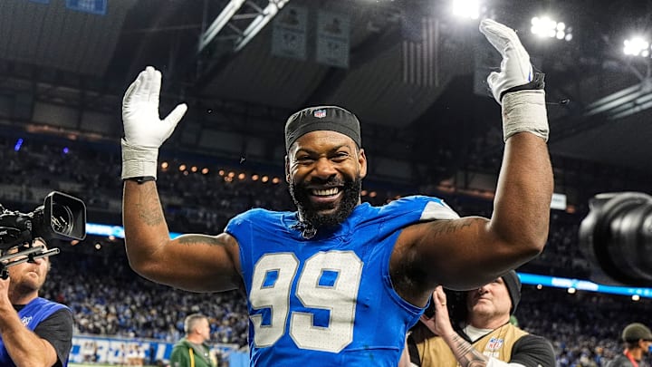 Detroit Lions defensive end Za'Darius Smith (99) celebrates 34-31 win over Green Bay Packers as he exits the field at Ford Field in Detroit on Thursday, Dec. 5, 2024.