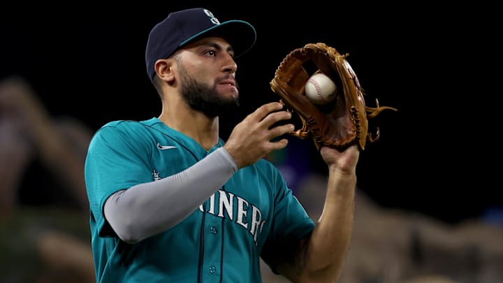 Seattle Mariners third baseman Abraham Toro catches a foul ball against the Los Angeles Angels on Sept. 17, 2022, at Angel Stadium.