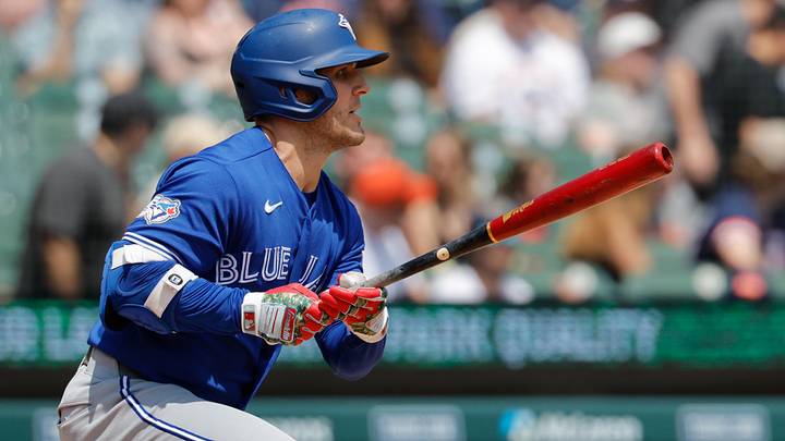 Toronto Blue Jays center fielder Daulton Varsho (5) hits an RBI triple. Toronto Blue Jays center fielder Daulton Varsho (5) hits an RBI triple.