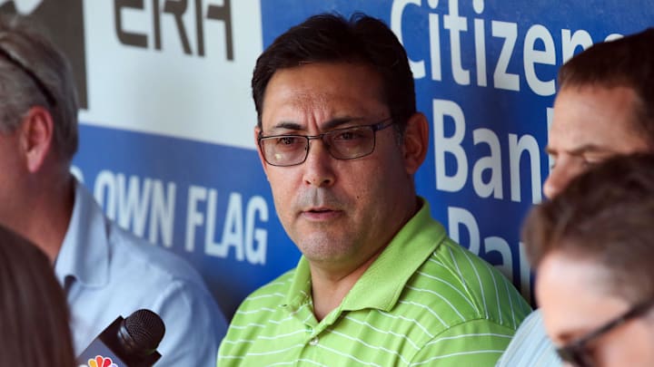 Jul 25, 2014; Philadelphia, PA, USA; Philadelphia Phillies general manager Ruben Amaro, Jr. talks with reporters during batting practice before a game against the Arizona Diamondbacks at Citizens Bank Park. Mandatory Credit: Bill Streicher-Imagn Images