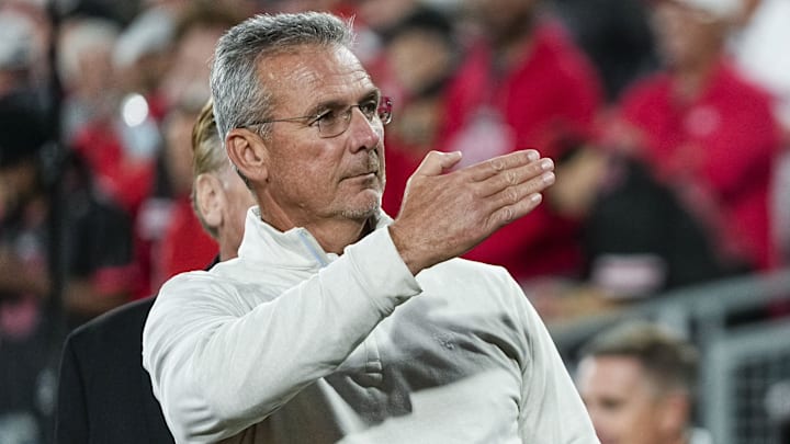 Former Ohio State Buckeyes head coach Urban Meyer salutes the fans chanting his name during the College Football Playoff quarterfinal against the Oregon Ducks at the Rose Bowl in Pasadena, Calif. on Jan. 1, 2025. Ohio State won 41-21.