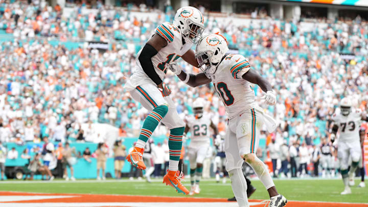 Miami Dolphins wide receiver Jaylen Waddle (17) celebrates his touchdown against the New England Patriots with wide receiver Tyreek Hill (10) during the second half at Hard Rock Stadium in 2023.