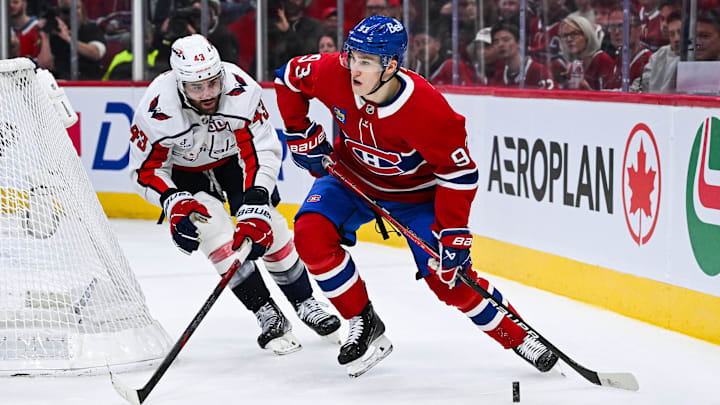 Apr 27, 2025; Montreal, Quebec, CAN; Montreal Canadiens right wing Ivan Demidov (93) plays the puck against Washington Capitals right wing Tom Wilson (43) during the third period in game four of the first round of the 2025 Stanley Cup Playoffs at Bell Centre. Mandatory Credit: David Kirouac-Imagn Images