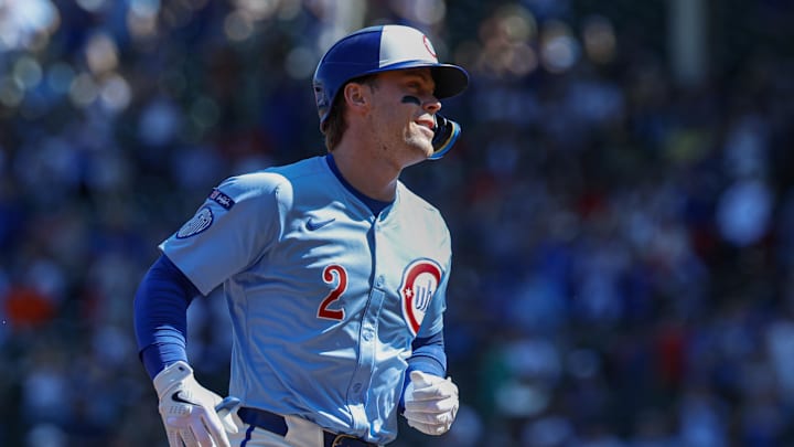 Sep 26, 2025; Chicago, Illinois, USA; Chicago Cubs second baseman Nico Hoerner (2) rounds the bases after hitting a solo home run against the St. Louis Cardinals during the first inning at Wrigley Field. Mandatory Credit: Kamil Krzaczynski-Imagn Images