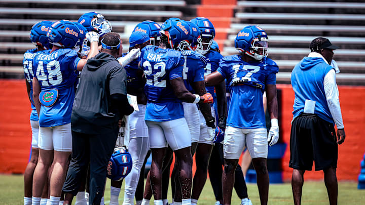 The Florida Gators edge rushers group together during the team's position drills period on Saturday.