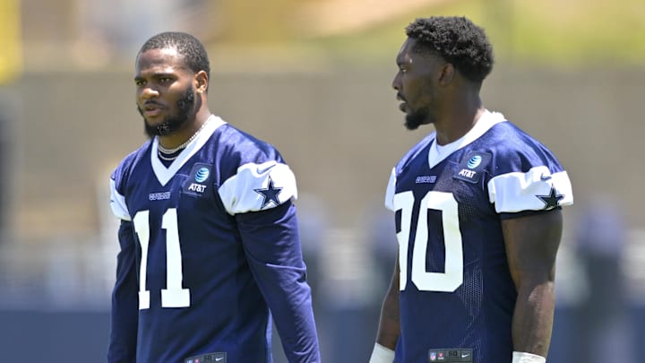 Oxnard, CA, USA; Dallas Cowboys star Micah Parsons and Dallas Cowboys defensive end DeMarcus Lawrence walk on the field during training camp drill at River Ridge Playing Fields.