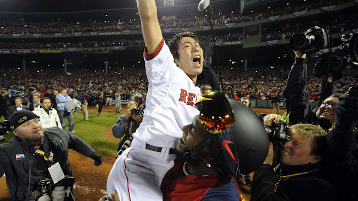 Boston, MA, USA; Boston Red Sox relief pitcher Koji Uehara is lifted by designated hitter David Ortiz after Game 6 of the MLB baseball World Series against the St. Louis Cardinals at Fenway Park. The Red Sox won 6-1 to win the series four games to two. Boston, MA, USA; Boston Red Sox relief pitcher Koji Uehara is lifted by designated hitter David Ortiz after Game 6 of the MLB baseball World Series against the St. Louis Cardinals at Fenway Park. The Red Sox won 6-1 to win the series four games to two.