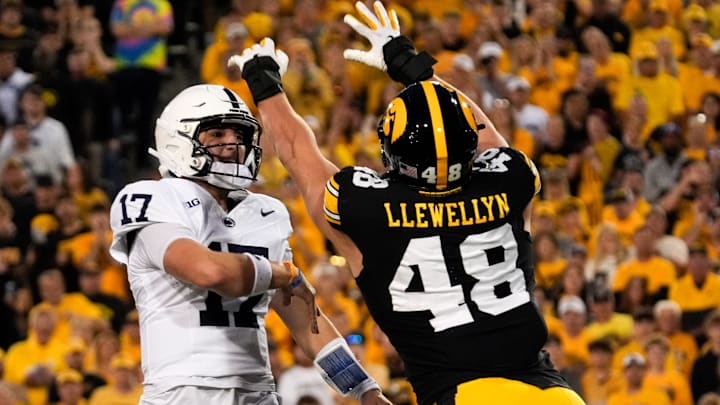 Iowa Hawkeyes defensive end Max Llewellyn (48) pressures Penn State Nittany Lions quarterback Ethan Grunkemeyer (17) at Kinnick Stadium. Iowa Hawkeyes defensive end Max Llewellyn (48) pressures Penn State Nittany Lions quarterback Ethan Grunkemeyer (17) at Kinnick Stadium.