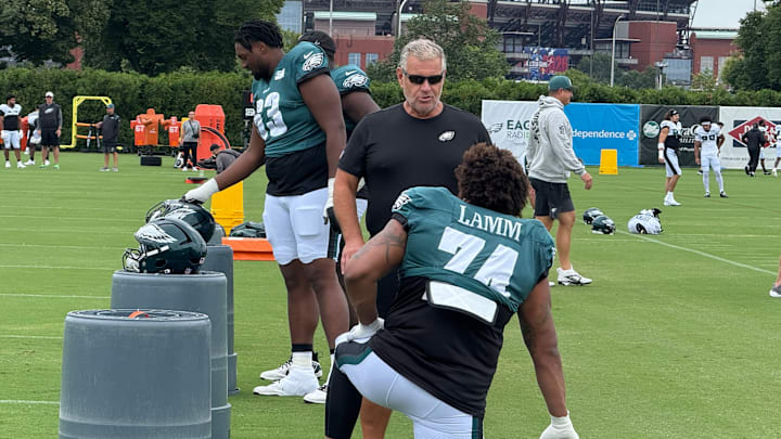 Offensive tackle Kendall Lamm and Jline coach Jeff Stoutland converse before the start of Day 7 at Eagles training camp. Offensive tackle Kendall Lamm and Jline coach Jeff Stoutland converse before the start of Day 7 at Eagles training camp.