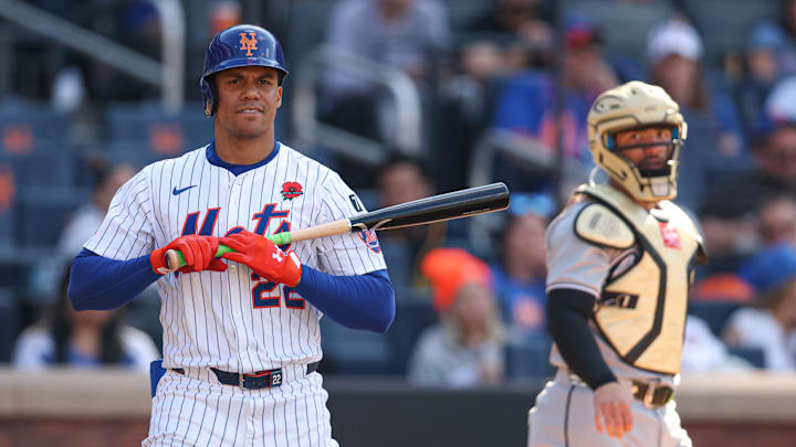 May 26, 2025; New York City, New York, USA; New York Mets right fielder Juan Soto (22) reacts after striking out during the fourth inning as Chicago White Sox catcher Edgar Quero (7) looks back at Citi Field. Mandatory Credit: Vincent Carchietta-Imagn Images