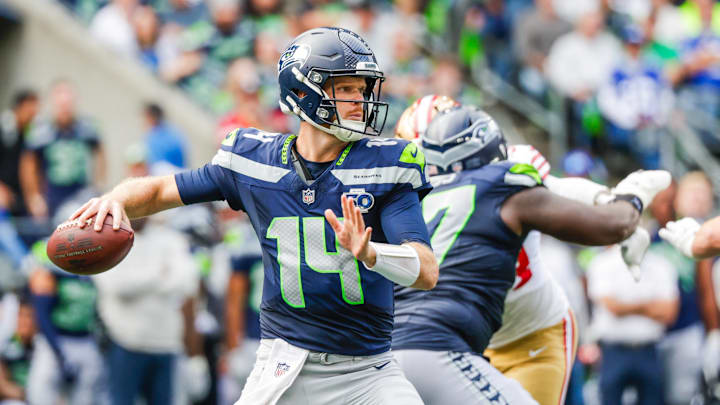 Sep 7, 2025; Seattle, Washington, USA; Seattle Seahawks quarterback Sam Darnold (14) passes against the San Francisco 49ers during the fourth quarter at Lumen Field. Mandatory Credit: Joe Nicholson-Imagn Images