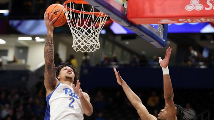 Mar 8, 2025; Pittsburgh, Pennsylvania, USA; Pittsburgh Panthers forward Cameron Corhen (2) shoots against Boston College Eagles guard Donald Hand Jr. (13) during the first half at the Petersen Events Center. Mandatory Credit: Charles LeClaire-Imagn Images Mar 8, 2025; Pittsburgh, Pennsylvania, USA; Pittsburgh Panthers forward Cameron Corhen (2) shoots against Boston College Eagles guard Donald Hand Jr. (13) during the first half at the Petersen Events Center. Mandatory Credit: Charles LeClaire-Imagn Images
