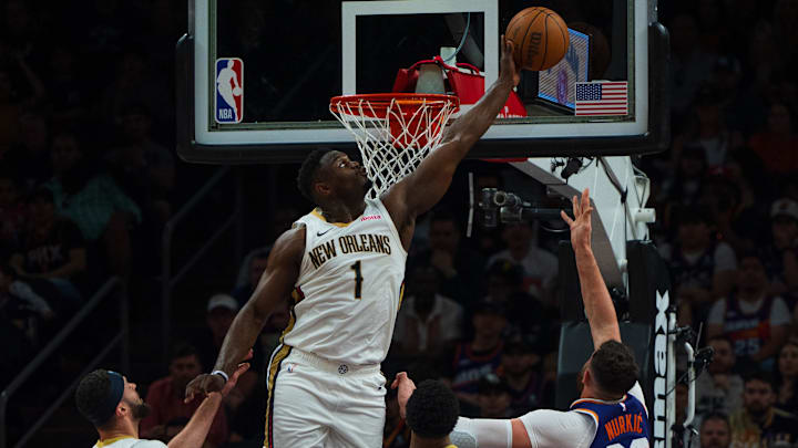 Apr 7, 2024; Phoenix, Arizona, USA;  New Orleans Pelicans forward Zion Williamson (1) blocks the shot of Phoenix Suns center Jusuf Nurkic (20) during the first half at Footprint Center.