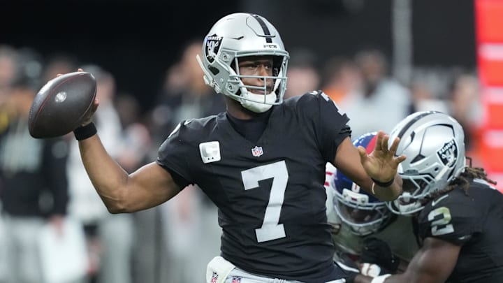 Dec 28, 2025; Paradise, Nevada, USA; Las Vegas Raiders quarterback Geno Smith (7) throws in the third quarter against the New York Giants at Allegiant Stadium. Mandatory Credit: Kirby Lee-Imagn Images