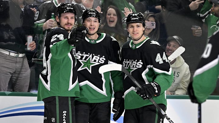 Nov 28, 2025; Dallas, Texas, USA; Dallas Stars center Roope Hintz (24) and left wing Jason Robertson (21) and defenseman Vladislav Kolyachonok (44) celebrates a goal scored by Robertson against the Utah Mammoth during the second period at the American Airlines Center. Mandatory Credit: Jerome Miron-Imagn Images