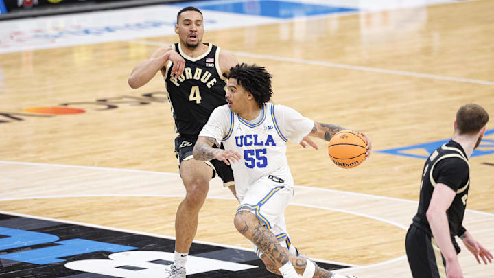 Mar 14, 2026; Chicago, IL, USA; UCLA Bruins guard Skyy Clark (55) drives to the basket against Purdue Boilermakers forward Trey Kaufman-Renn (4) during the first half at United Center. Mandatory Credit: Kamil Krzaczynski-Imagn Images Mar 14, 2026; Chicago, IL, USA; UCLA Bruins guard Skyy Clark (55) drives to the basket against Purdue Boilermakers forward Trey Kaufman-Renn (4) during the first half at United Center. Mandatory Credit: Kamil Krzaczynski-Imagn Images