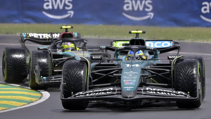 Aston Martin driver Fernando Alonso and Mercedes driver Lewis Hamilton race during the Canadian Grand Prix at Circuit Gilles Villeneuve.