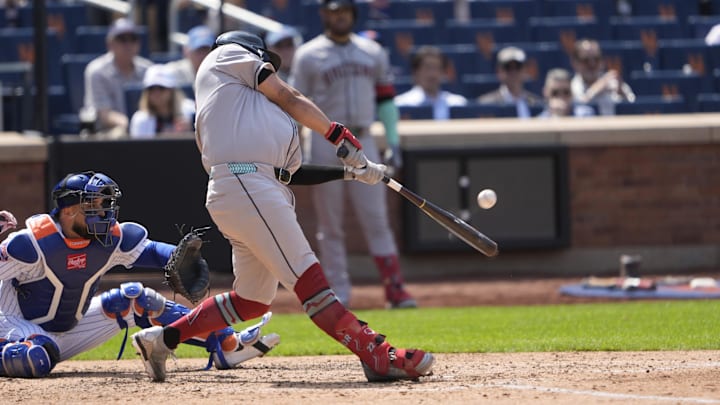 May 1, 2025; New York City, New York, USA; Arizona Diamondbacks first baseman Josh Naylor (22) hits a double against the New York Mets during the fifth inning at Citi Field. Mandatory Credit: Gregory Fisher-Imagn Images May 1, 2025; New York City, New York, USA; Arizona Diamondbacks first baseman Josh Naylor (22) hits a double against the New York Mets during the fifth inning at Citi Field. Mandatory Credit: Gregory Fisher-Imagn Images