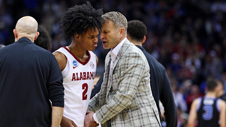 Mar 27, 2025; Newark, NJ, USA; Alabama Crimson Tide guard Aden Holloway (2) talks to head coach Nate Oats during the second half against the Brigham Young Cougars during an East Regional semifinal of the 2025 NCAA tournament at Prudential Center. Mandatory Credit: Vincent Carchietta-Imagn Images