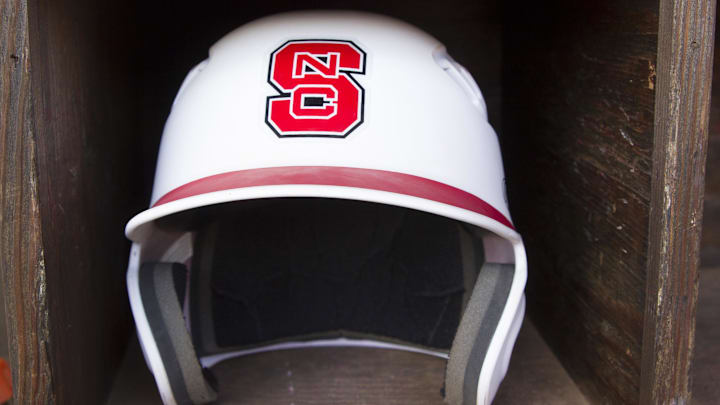 Jun 8, 2013; Raleigh, NC, USA; A North Carolina State Wolfpack helmet lies in the dugout prior to the game against the Rice Owls in the Raleigh super regional of the 2013 NCAA baseball tournament at Doak Field. Mandatory Credit: Jeremy Brevard-Imagn Images