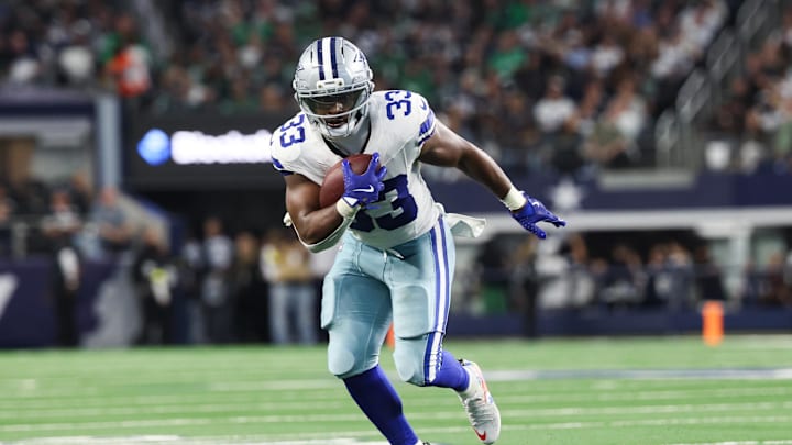 Nov 23, 2025; Arlington, Texas, USA; Dallas Cowboys running back Javonte Williams (33) runs with the ball in the second quarter against the Philadelphia Eagles at AT&T Stadium. 