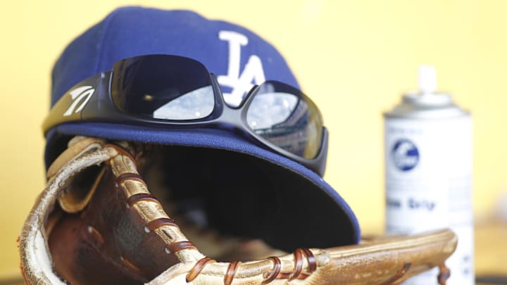 A Los Angeles Dodgers hat glove and sunglasses in the dugout against the Pittsburgh Pirates during the fourth inning at PNC Park on June 16, 2013. A Los Angeles Dodgers hat glove and sunglasses in the dugout against the Pittsburgh Pirates during the fourth inning at PNC Park on June 16, 2013.