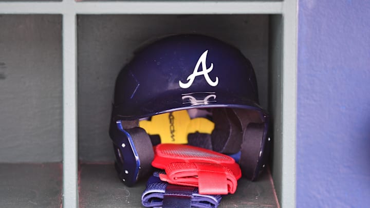 Mar 31, 2024; Philadelphia, Pennsylvania, USA; Atlanta Braves batting helmet inside the dugout before game against the Philadelphia Phillies at Citizens Bank Park. Mandatory Credit: Eric Hartline-Imagn Images