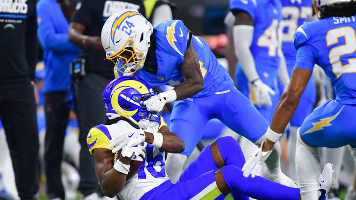 Aug 27, 2026; Inglewood, California, USA; Los Angeles Chargers cornerback Rodney Shelley (24) brings down Los Angeles Rams wide receiver Tru Edwards (16) during the first half at SoFi Stadium. Mandatory Credit: Gary A. Vasquez-Imagn Images