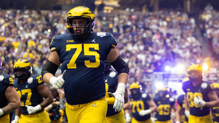Dec 31, 2022; Glendale, Arizona, USA; Michigan Wolverines offensive lineman Andrew Gentry (75) against the TCU Horned Frogs during the 2022 Fiesta Bowl at State Farm Stadium. Mandatory Credit: Mark J. Rebilas-Imagn Images Dec 31, 2022; Glendale, Arizona, USA; Michigan Wolverines offensive lineman Andrew Gentry (75) against the TCU Horned Frogs during the 2022 Fiesta Bowl at State Farm Stadium. Mandatory Credit: Mark J. Rebilas-Imagn Images