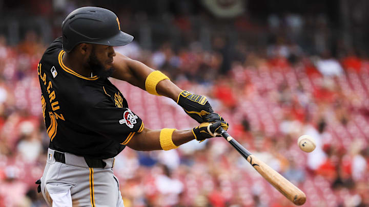 Pittsburgh Pirates outfielder Bryan De La Cruz (41) hits a single in the ninth inning against the Cincinnati Reds at Great American Ball Park. 