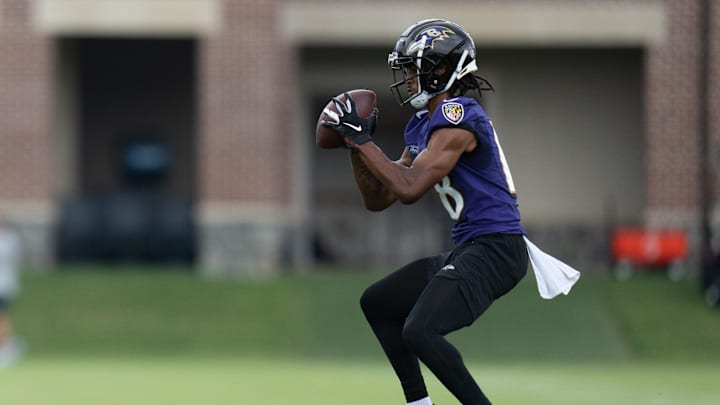 Jul 27, 2022; Owings Mills, MD, USA; Baltimore Ravens cornerback Kyle Fuller (18) catches a ball during day one of training camp at Under Armour Performance Center. Mandatory Credit: Jessica Rapfogel-Imagn Images Jul 27, 2022; Owings Mills, MD, USA; Baltimore Ravens cornerback Kyle Fuller (18) catches a ball during day one of training camp at Under Armour Performance Center. Mandatory Credit: Jessica Rapfogel-Imagn Images