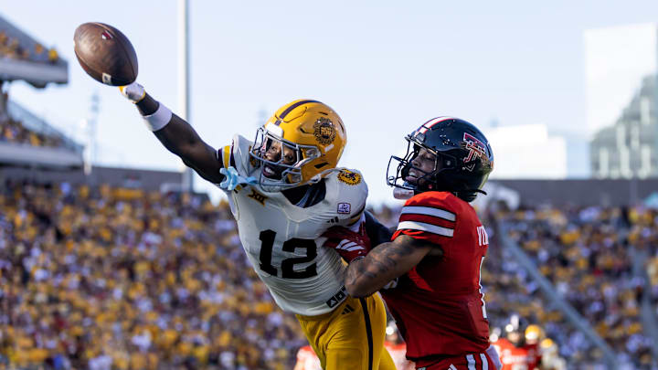 Oct 18, 2025; Tempe, Arizona, USA; Arizona State Sun Devils defensive back Javan Robinson (12) breaks up a pass to Texas Tech Red Raiders wide receiver Kelby Valsin