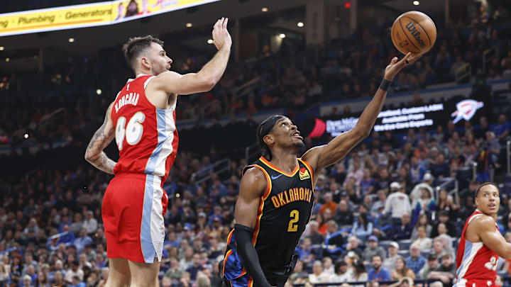 Dec 29, 2024; Oklahoma City, Oklahoma, USA; Oklahoma City Thunder guard Shai Gilgeous-Alexander (2) shoots in front of Memphis Grizzlies guard John Konchar (46) during the second quarter at Paycom Center. Mandatory Credit: Alonzo Adams-Imagn Images Dec 29, 2024; Oklahoma City, Oklahoma, USA; Oklahoma City Thunder guard Shai Gilgeous-Alexander (2) shoots in front of Memphis Grizzlies guard John Konchar (46) during the second quarter at Paycom Center. Mandatory Credit: Alonzo Adams-Imagn Images