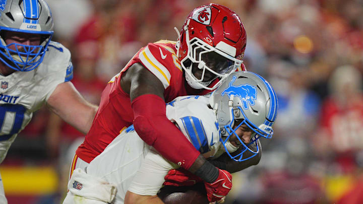 Oct 12, 2025; Kansas City, Missouri, USA; Kansas City Chiefs defensive end Charles Omenihu (90) sacks Detroit Lions quarterback Jared Goff (16) during the second half at GEHA Field at Arrowhead Stadium. Mandatory Credit: Jay Biggerstaff-Imagn Images