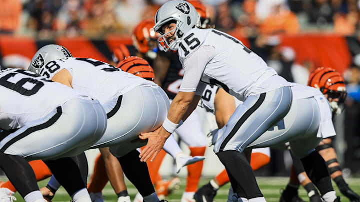 Nov 3, 2024; Cincinnati, Ohio, USA; Las Vegas Raiders quarterback Gardner Minshew (15) snaps the ball against the Cincinnati Bengals in the first half at Paycor Stadium. Mandatory Credit: Katie Stratman-Imagn Images