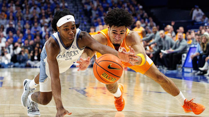 Feb 7, 2026; Lexington, Kentucky, USA; Kentucky Wildcats guard Jasper Johnson (2) and Tennessee Volunteers guard Bishop Boswell (3) dive for the ball during the first half at Rupp Arena at Central Bank Center. Mandatory Credit: Jordan Prather-Imagn Images