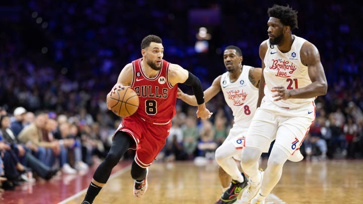 Mar 20, 2023; Philadelphia, Pennsylvania, USA; Chicago Bulls guard Zach LaVine (8) dribbles the ball against Philadelphia 76ers center Joel Embiid (21) during the fourth quarter at Wells Fargo Center. Mandatory Credit: Bill Streicher-USA TODAY Sports