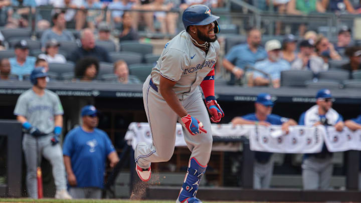 Aug 4, 2024; Bronx, New York, USA; Toronto Blue Jays first baseman Vladimir Guerrero Jr. (27) doubles during the third inning against the New York Yankees at Yankee Stadium. Aug 4, 2024; Bronx, New York, USA; Toronto Blue Jays first baseman Vladimir Guerrero Jr. (27) doubles during the third inning against the New York Yankees at Yankee Stadium.