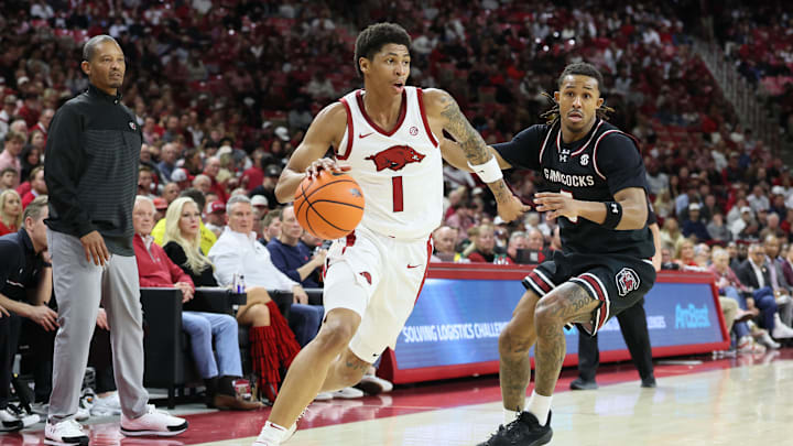 Jan 14, 2026; Fayetteville, Arkansas, USA; Arkansas Razorbacks guard Meleek Thomas (1) drives during the first half against South Carolina Gamecocks guard Meechie Johnson (5) at Bud Walton Arena. Mandatory Credit: Nelson Chenault-Imagn Images Jan 14, 2026; Fayetteville, Arkansas, USA; Arkansas Razorbacks guard Meleek Thomas (1) drives during the first half against South Carolina Gamecocks guard Meechie Johnson (5) at Bud Walton Arena. Mandatory Credit: Nelson Chenault-Imagn Images